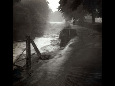 Waterfall and road in flood