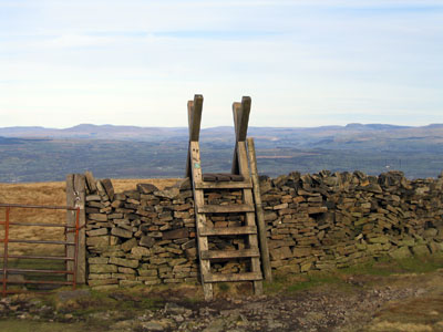 Turn right before the wall, with the 3 Peaks on the horizon